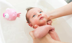 Newborn first bath